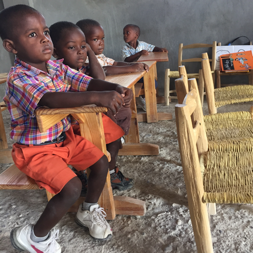 Kids in a classroom in Haiti.
